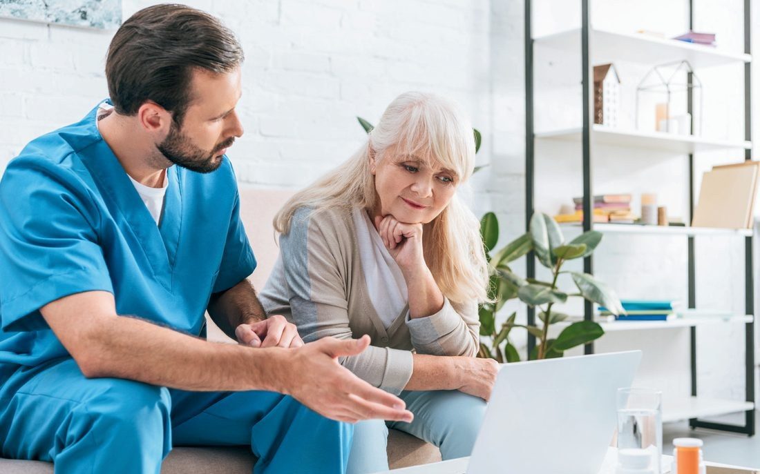 A hospice nurse reviewing medications with a patient