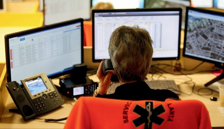 An on-call coordinator answering a call at night